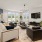 Lounge area with seating and a tv at Wayford at Innovation Park in Charlotte.