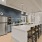 kitchen with island seating and fridge
