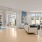 a room with seating and hardwood floors