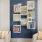 chairs and a bookcase on a blue wall