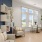 seating area with bookcase and windows