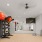 exercise equipment in a room with hardwood floors and large mirros