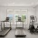 room with exercise equipment and large windows