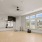 exercise equipment in a room with hardwood floors and large mirros
