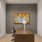 an office with a chair table and lamp