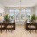 small room with tables chairs and windows